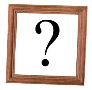 A question mark is inside a brown wooden frame picture frame. 