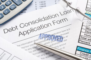 Close up of Approved Student Loan Debt Consolidation Application Form with pen, calculator, student loan forgiveness, april 30 deadline