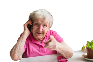 Elderly woman talks on a mobile phone and gestures.