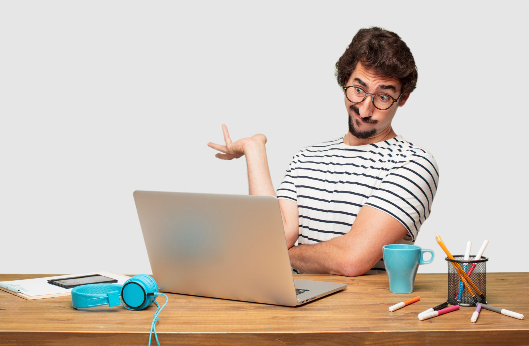 young bearded with a laptop with a quizzical and confused look, Trying to understand the new student loan forgiveness plan